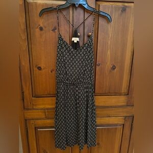 Loft Ladies XS black print sundress with string straps and elastic waist. EUC